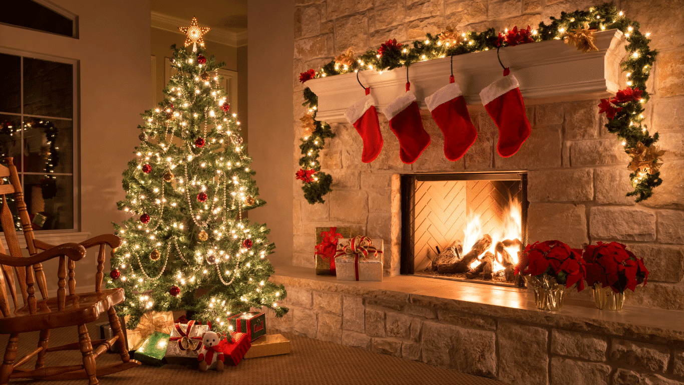 Image of a Christmas tree in front of a roaring fire